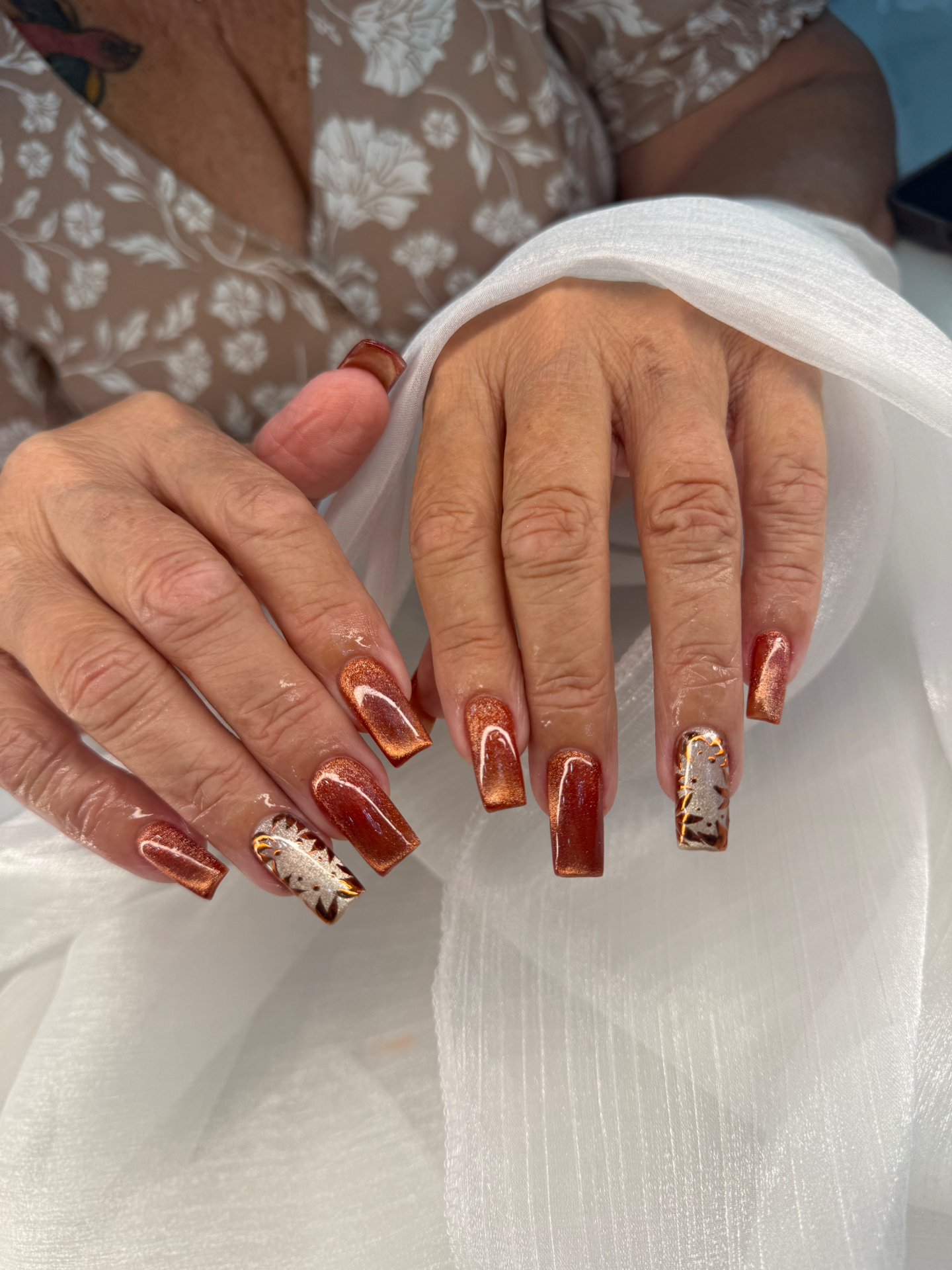 Copper shimmer square nails with leopard-print accent