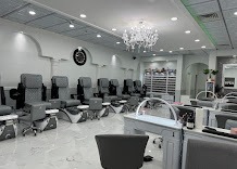 Inside the Luxe studio — pedicure thrones and crystal chandelier