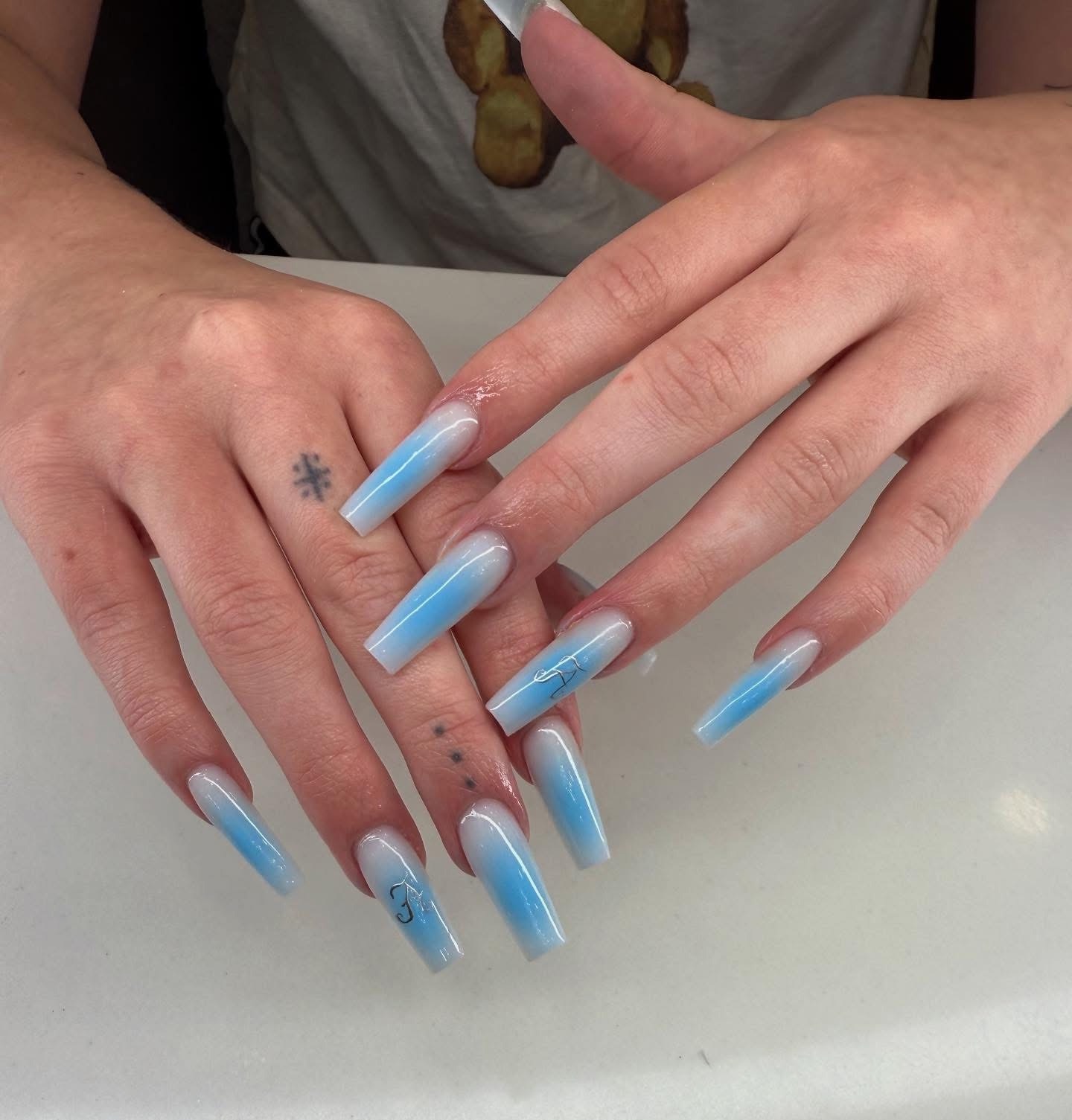 Long blue ombré almond extensions with fine line detail