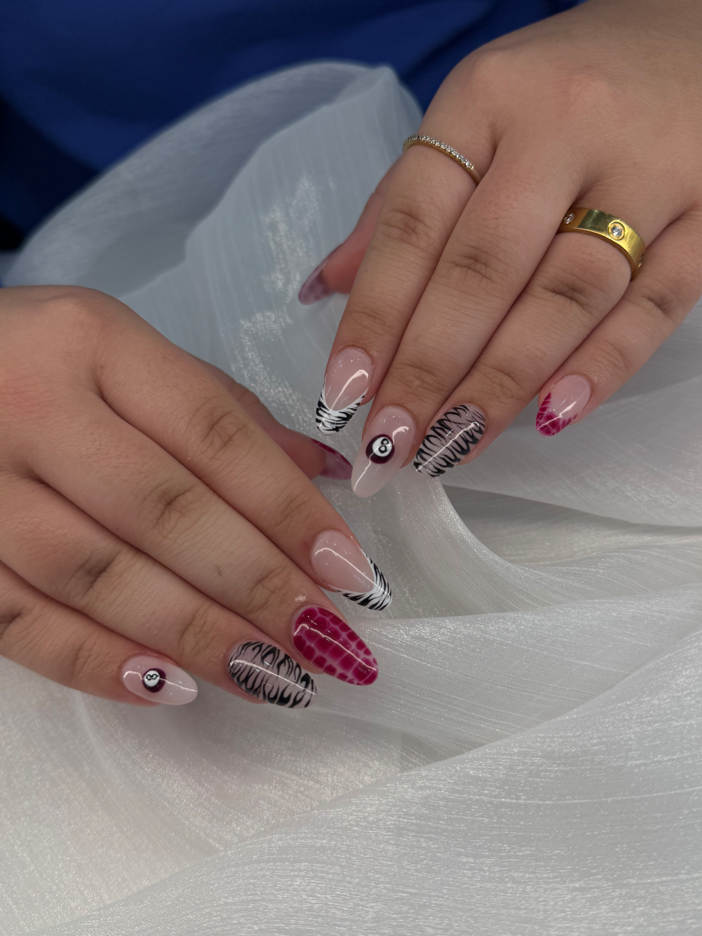 Magenta croc and zebra almond nails with eight-ball detail